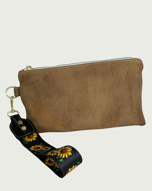Handmade brown faux suede wristlet with wide sunflower detachable strap and gold hardware.
