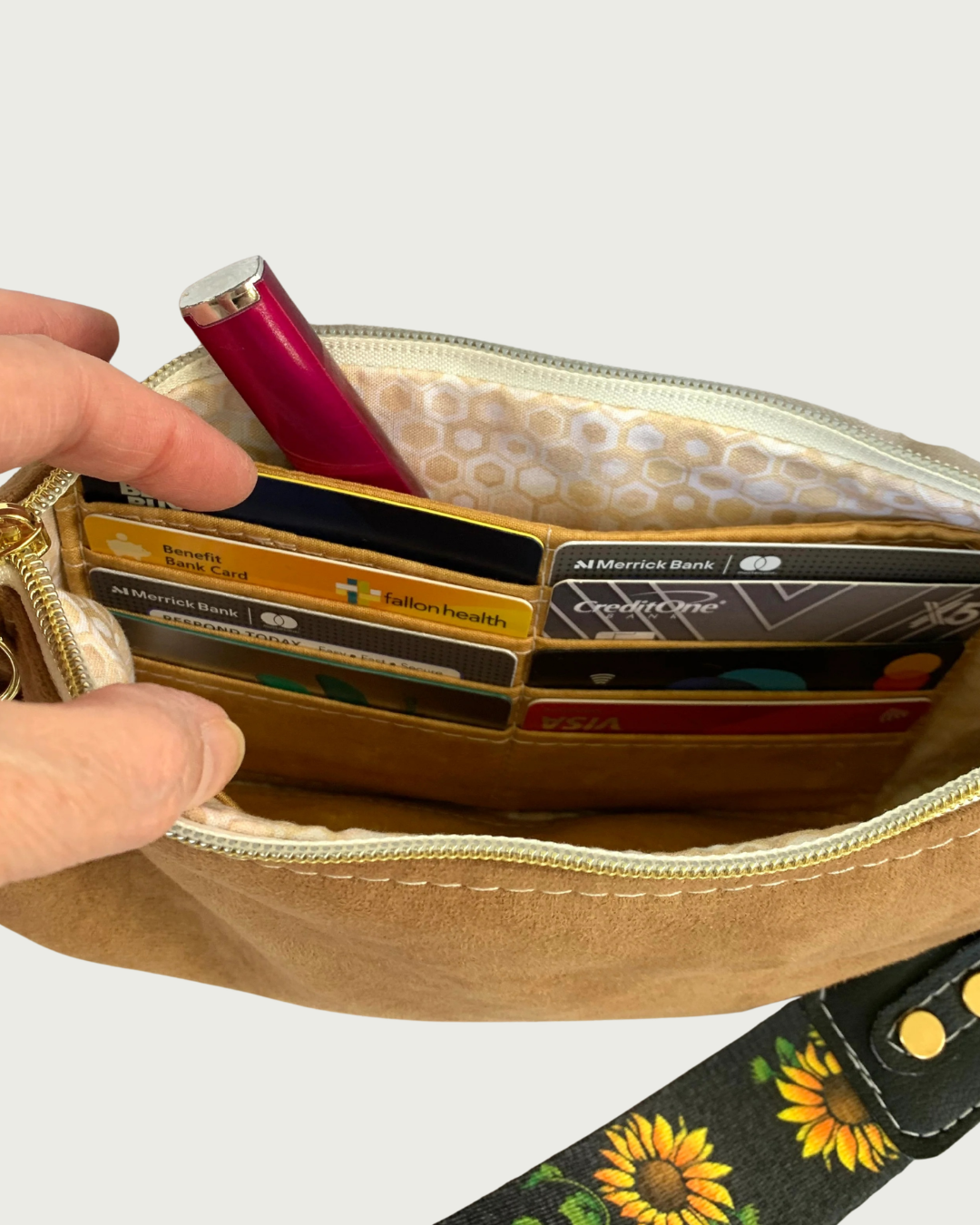 Handmade brown faux suede wristlet wallet interior showing 8 full card slots and a slip pocket.