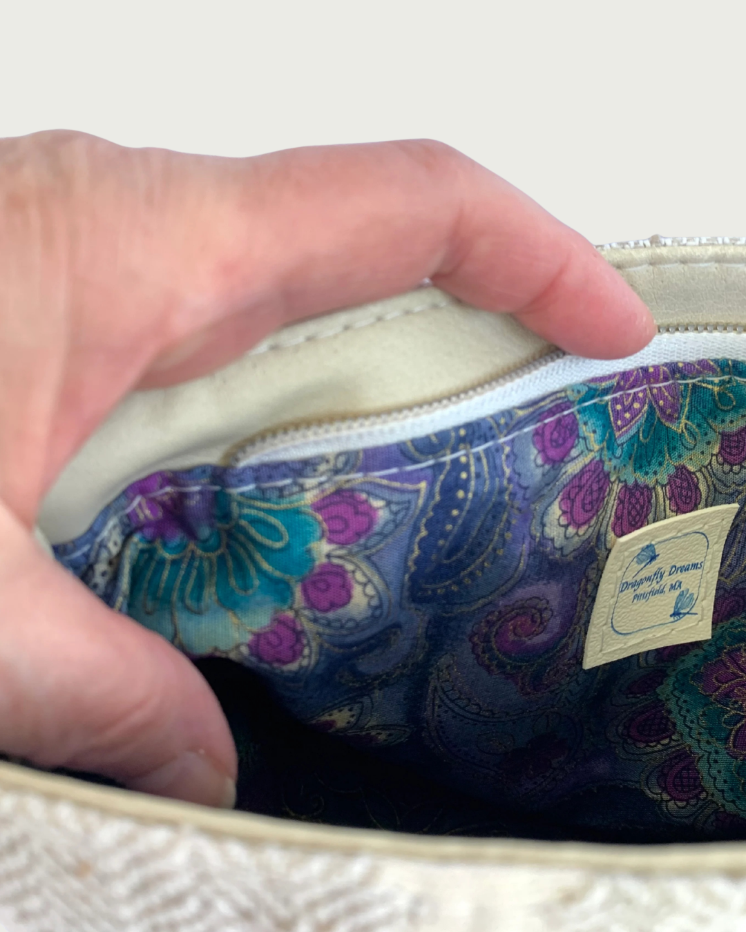 A handmade zippered  bag . Closeup view of interior lining.