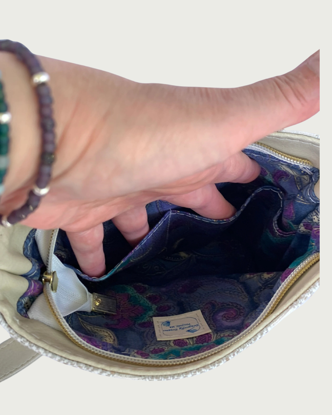 Handcrafted chevron slouchy shoulder bag . Closeup view of interior lining with 2 slip pockets.