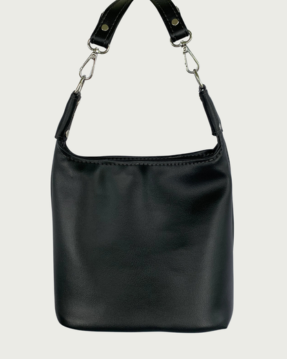 Handcrafted black vinyl slouchy shoulder bag with detachable strap.