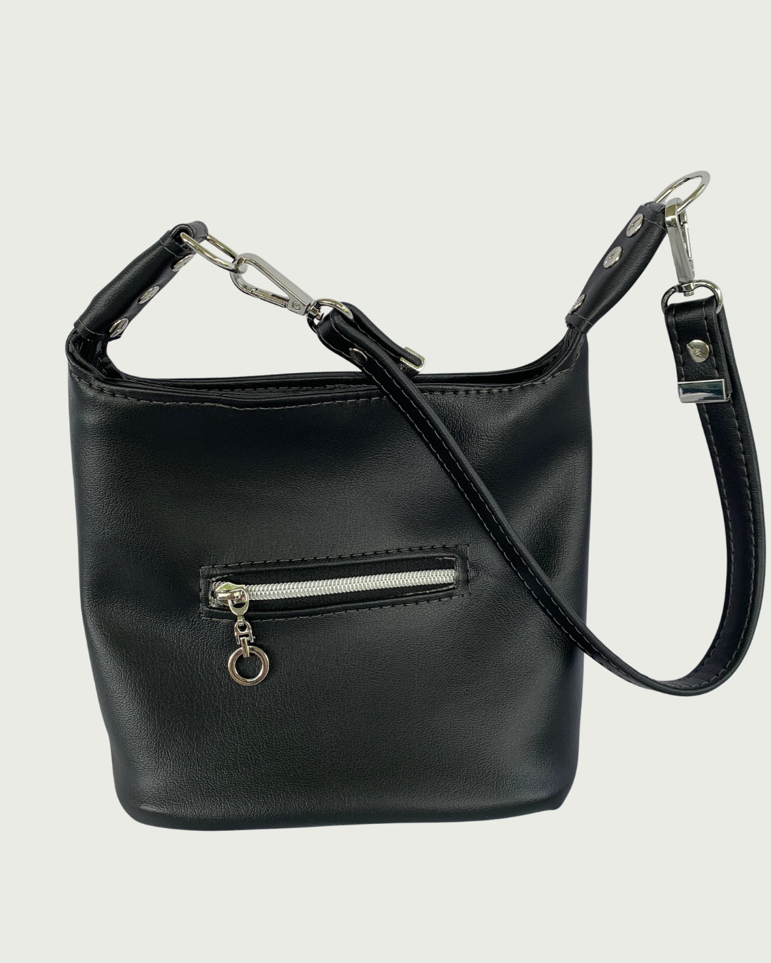 Handcrafted black vinyl slouchy shoulder bag with small exterior zippered pocket, nickel hardware, and detachable strap.