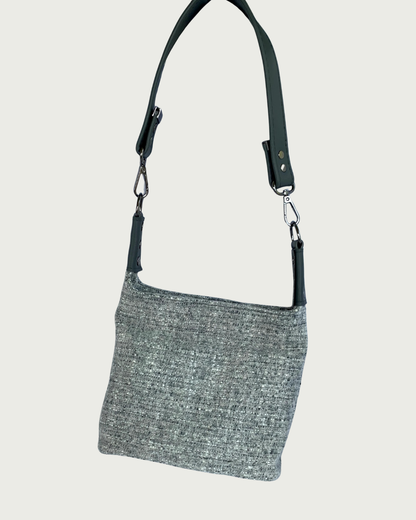 Gray wool-like shoulder bag with a detachable gray vinyl strap.and gunmetal hardware.