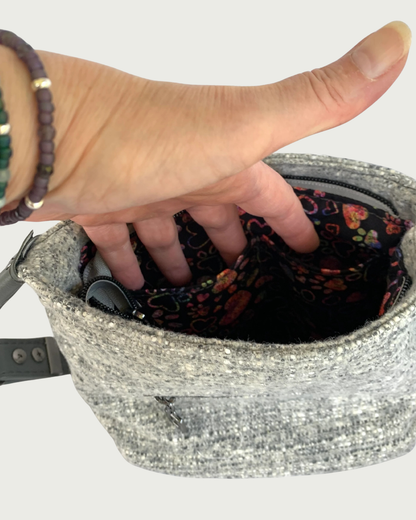 Gray wool-like handbag's interior lining and two slip pockets.