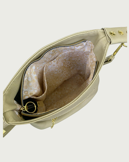 A solid beige faux leather slouchy shoulder bag interior lining with 2 slip pockets.